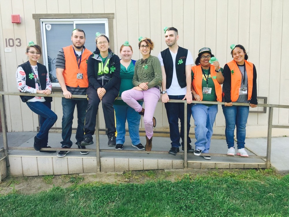 El Dorado's Step-Up leadership posing together with small green hats on St. Patrick's Day. 